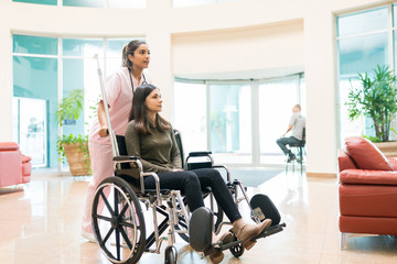 woman being pushed in wheelchair
