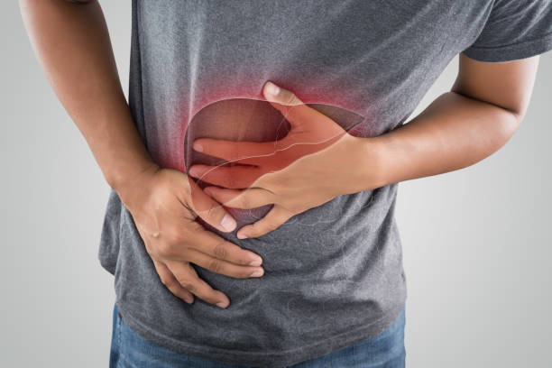 man clutching stomach with photo of human liver overlayed